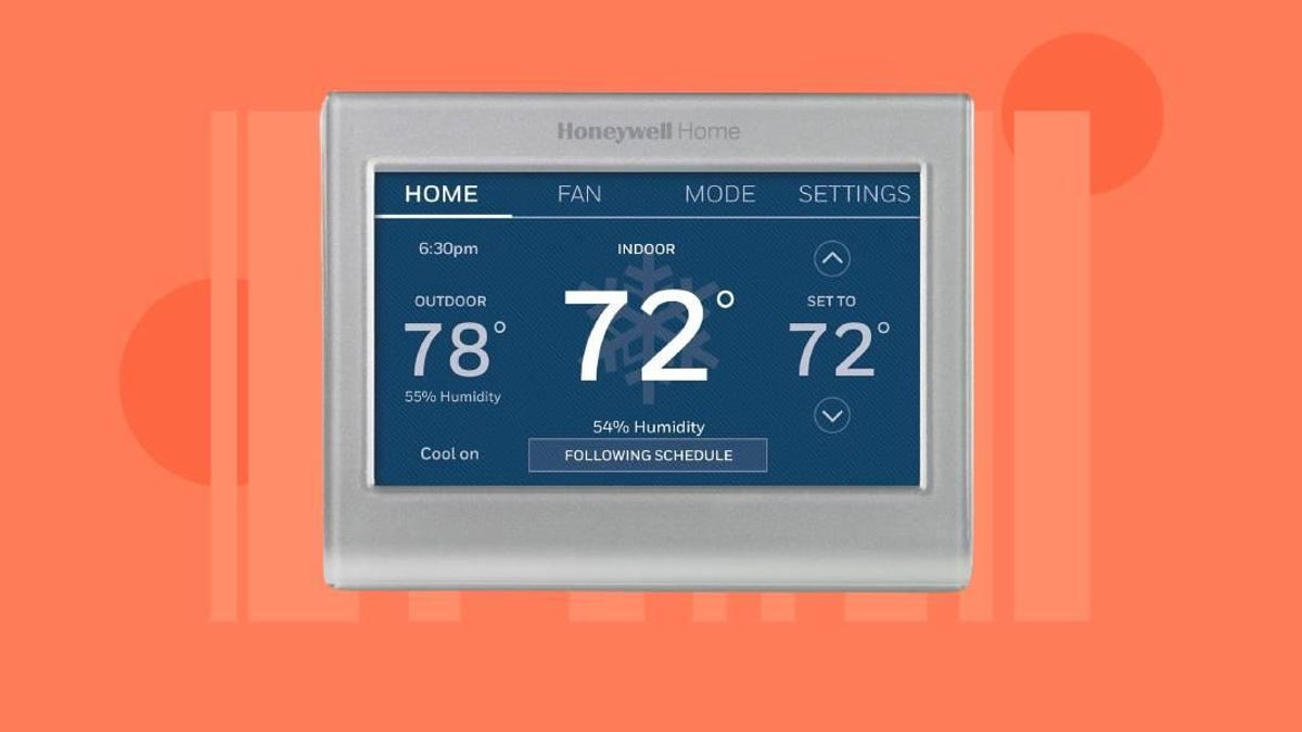 A smart thermostat on a red-orange background.