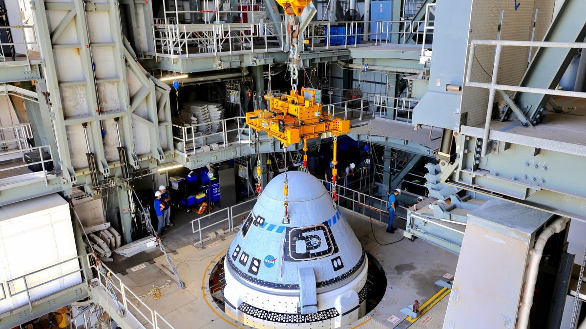 Boeing's CST-100 Starliner spacecraft is secured atop a United Launch Alliance Atlas V rocket at the Vertical Integration Facility at Space Launch Complex-41 at Florida's Cape Canaveral Space Force Station on July 17, 2021.