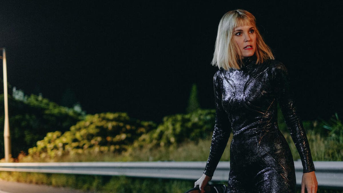 Leslie Bibb as Satan on the side of the road