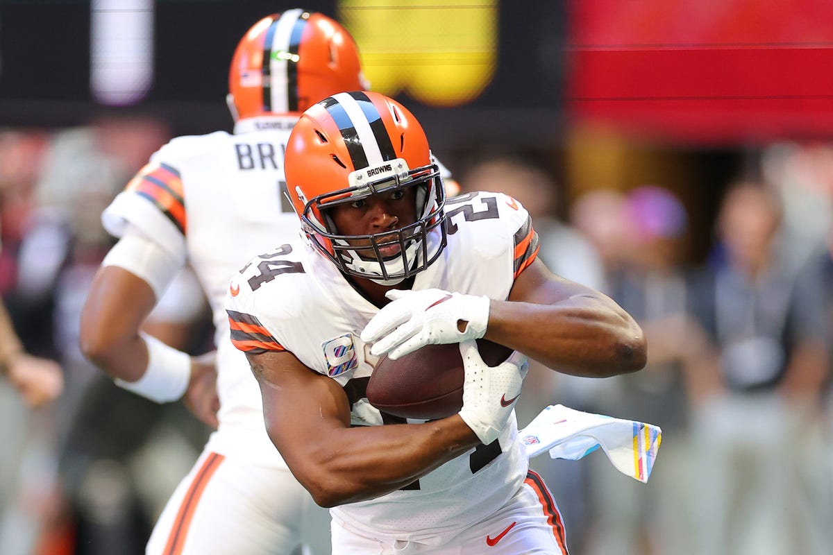 Cleveland Browns running back Nick Chubb runs with a football.