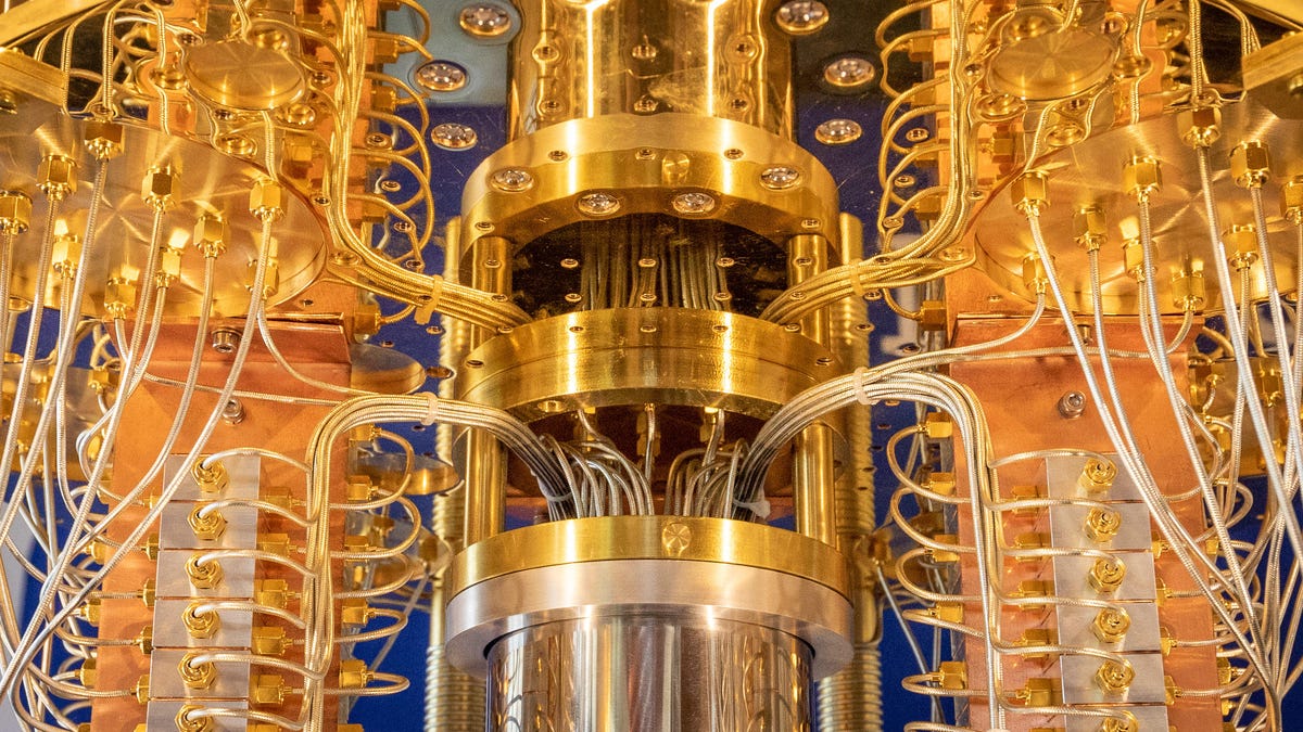 A closeup view of an IBM quantum computer, with dozens of gleaming coaxial cables