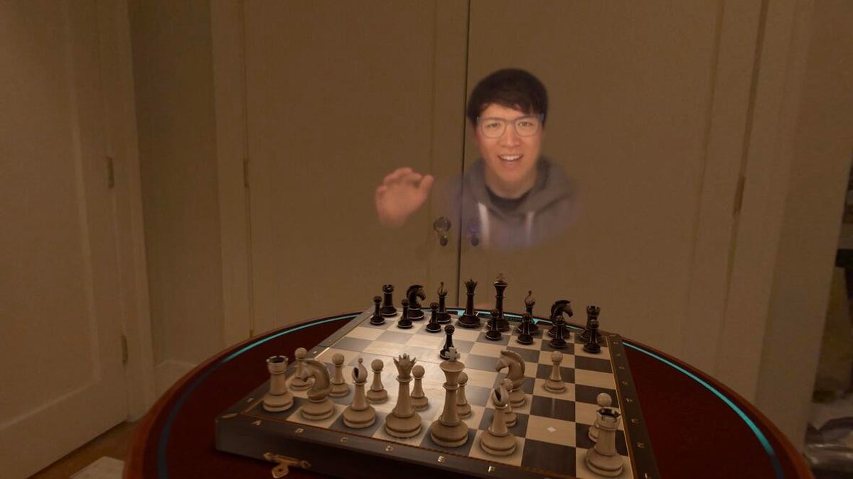 A virtual persona playing chess in mixed reality on Apple's Vision Pro