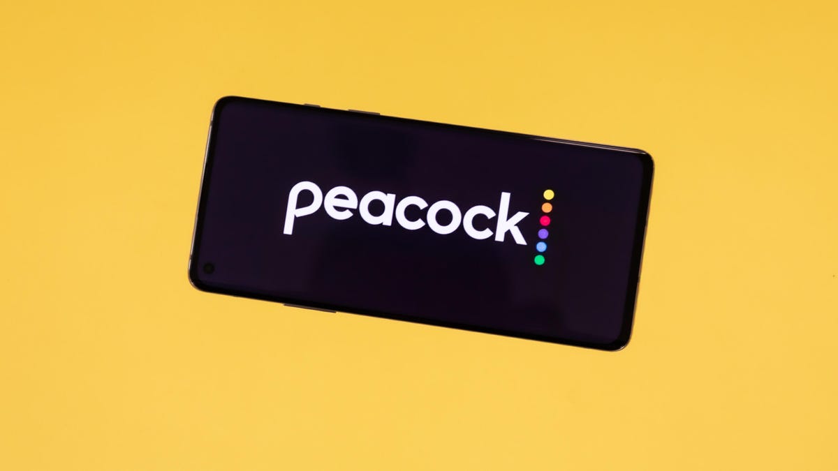 Peacock's logo on an iPhone against a solid background