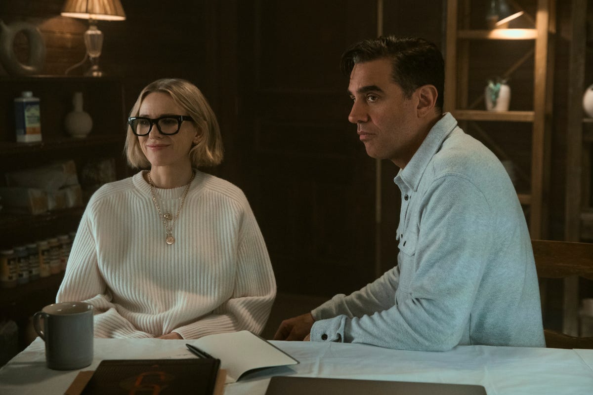 Naomi Watts and Bobby Cannavale sitting at a desk in an office