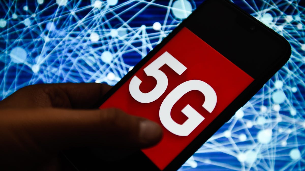 In this photo illustration a 5G logo seen displayed on a