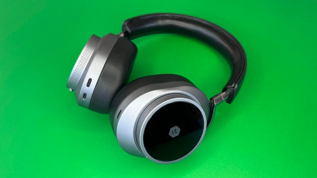 Master & Dynamic MW75 headphones on green background