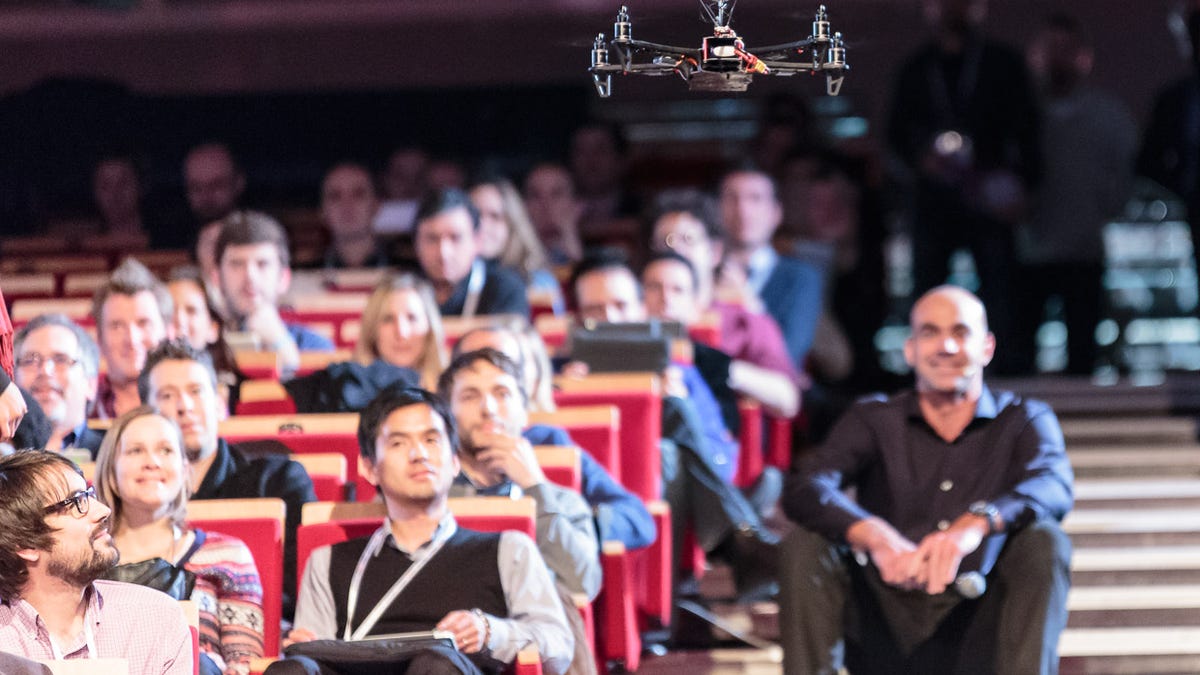 Team BlackSheep's TBS Discovery quadcopter flies above the audience at LeWeb 2012 in Paris.