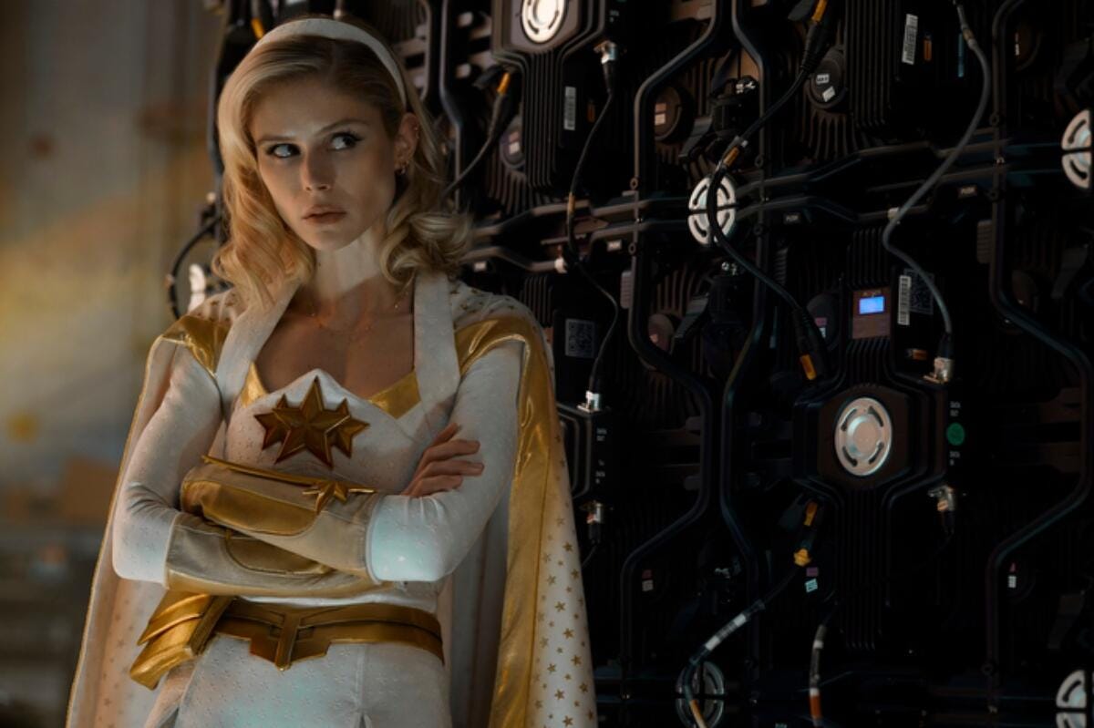 Starlight, played by Erin Moriarty, leans against a rack in The Boys.