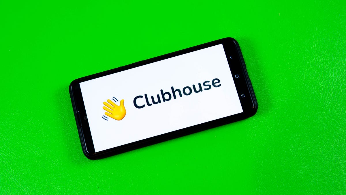 Clubhouse app on a smartphone on green background