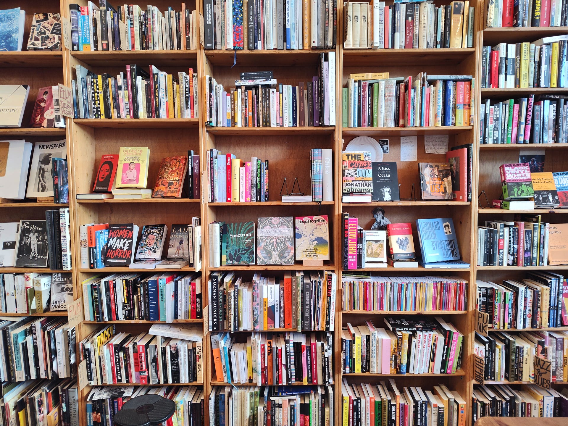 A wall of bookshelves filled with books