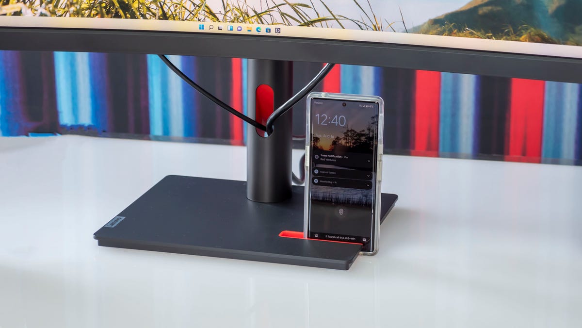 The base of the new Thinkvision monitor stand with an Android phone propped up in portrait orientation in the base's notch