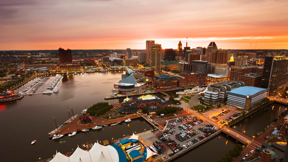 An image of Baltimore&apos;s Inner Harbor at sunset.