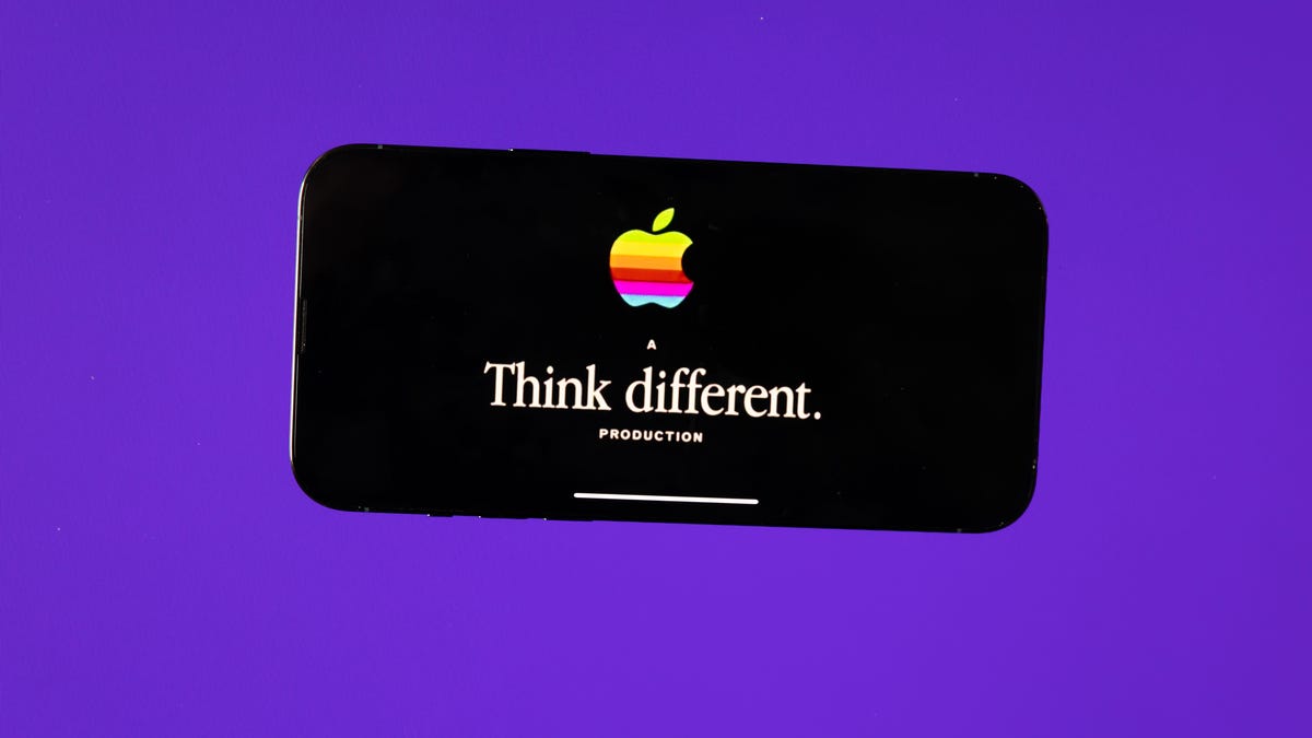 Apple logo and "Think different" slogan on an iPhone screen