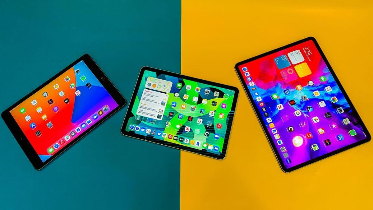 Three iPads against a yellow and blue background.
