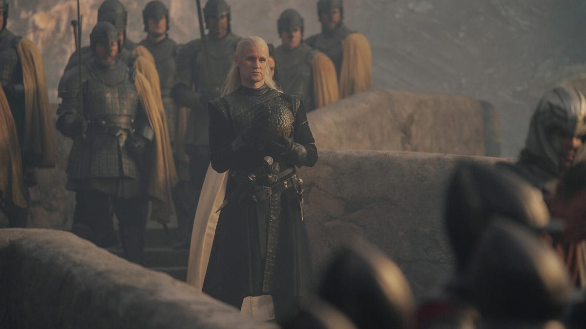 Matt Smith as Daemon Targaryen, standing on a rampart amid armor-clad soldiers