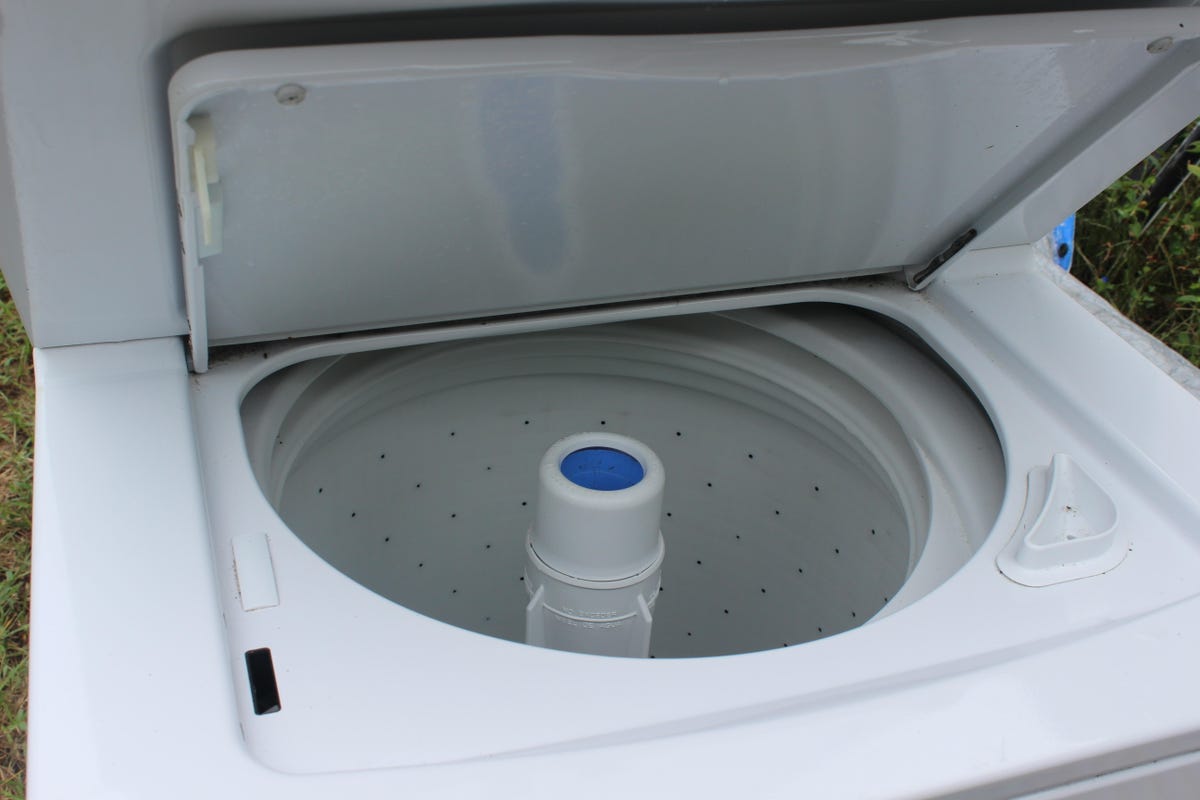 Close-up of an open top-loading washer.