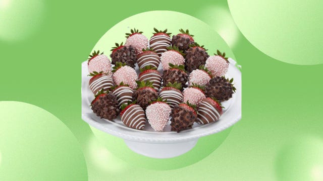 A bowl of gourmet Mother's Day dipped strawberries from Shari's Berries is displayed against a green background.