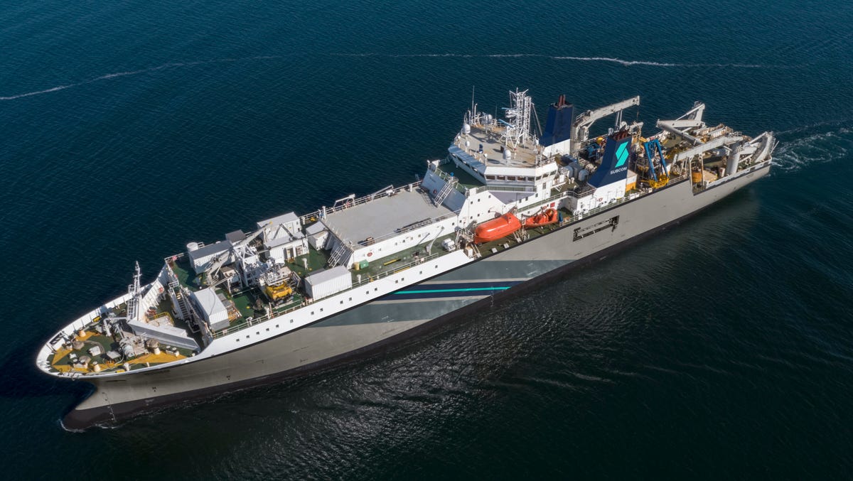 SubCom's Responder cable-laying ship floats on a blue ocean.