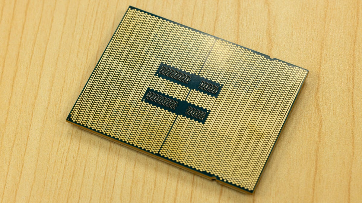 The bottom of the Sapphire Rapids Xeon chip is covered with thousands of tiny metal contact patches for data and power links. This whole package will be pressed with hundreds of pounds of force onto a circuit board to ensure good electrical contacts.