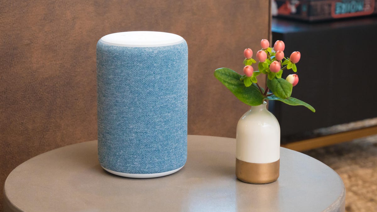 An Amazon Echo rests on a table