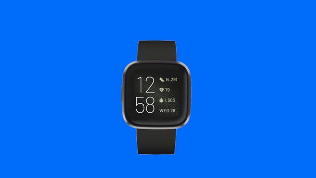 Close up of Fitbit Versa 2 on a blue background