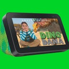 Amazon Echo Show 5 Kids with chameleon design showing Dino Dana on screen