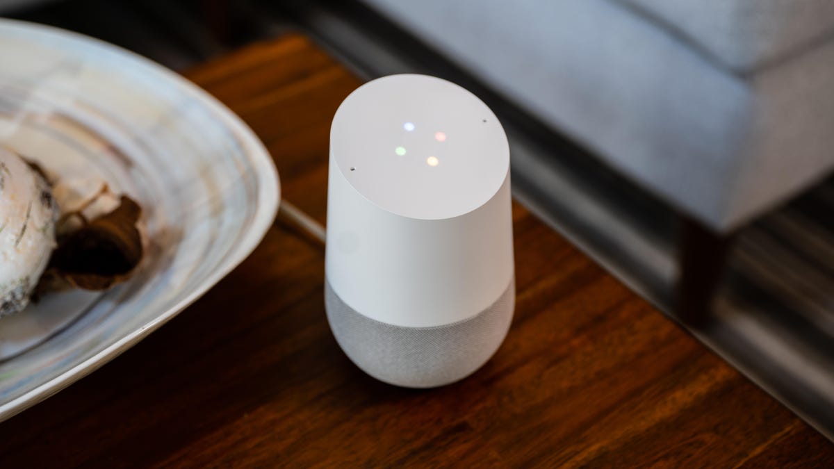 google home next to a thanksgiving dinner plate