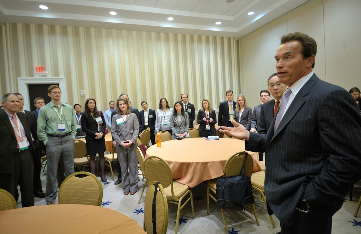 Former California governor Arnold Schwarzenegger and Energy Secretary Steven Chu speak to a group of university students who attended the ARPA-E Summit.