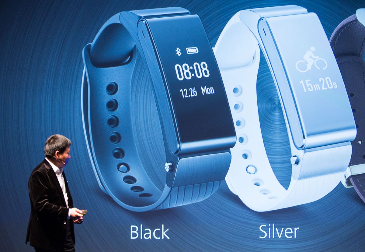 Richard Yu, CEO of Huawei's consumer group, shows the TalkBand B2 at Mobile World Congress.