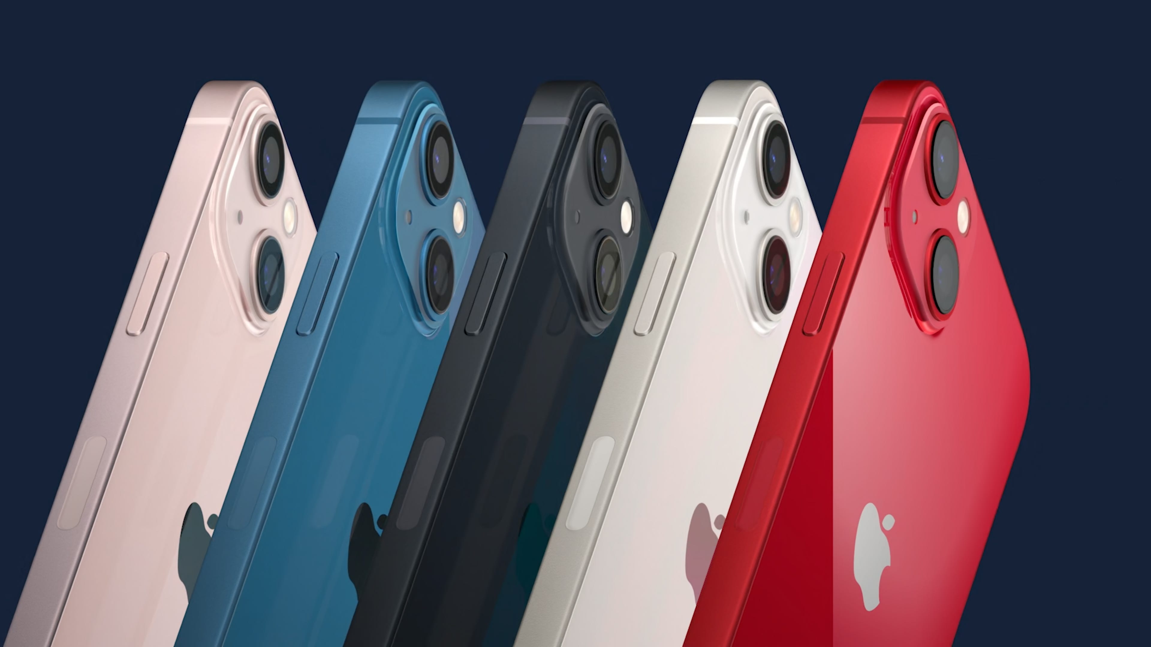 Five iPhones in different colors sit side by side