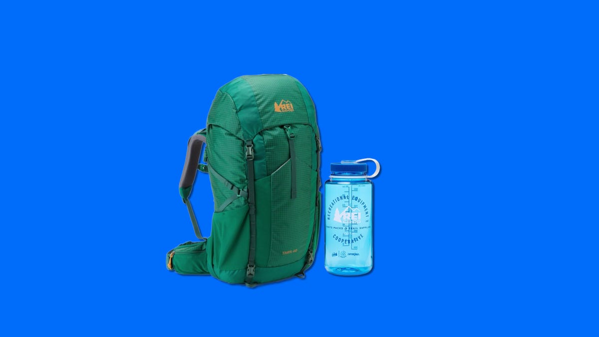 Backpack and water bottle on a blue background