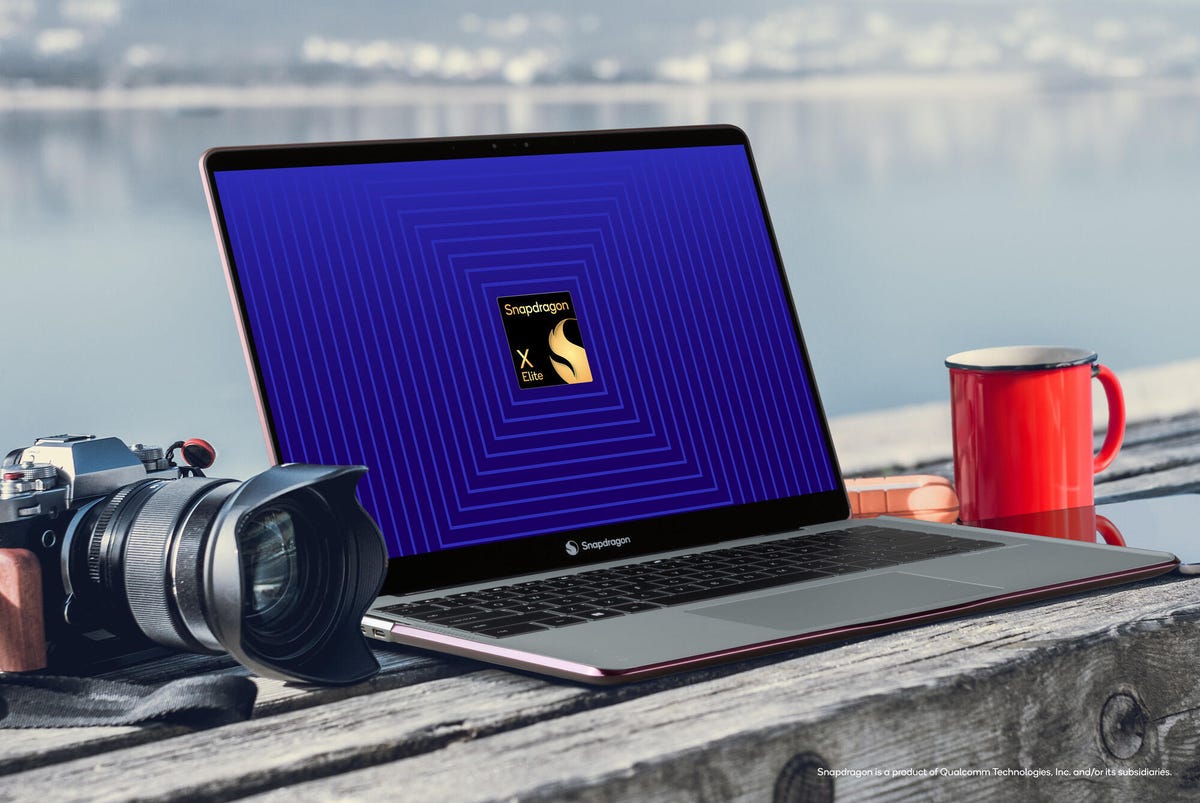 A laptop sits open with the Snapdragon X Elite logo centered on its screen.