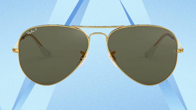 Ray-Ban Rb3025 Classic Polarized Aviator Sunglasses are displayed against a blue background.