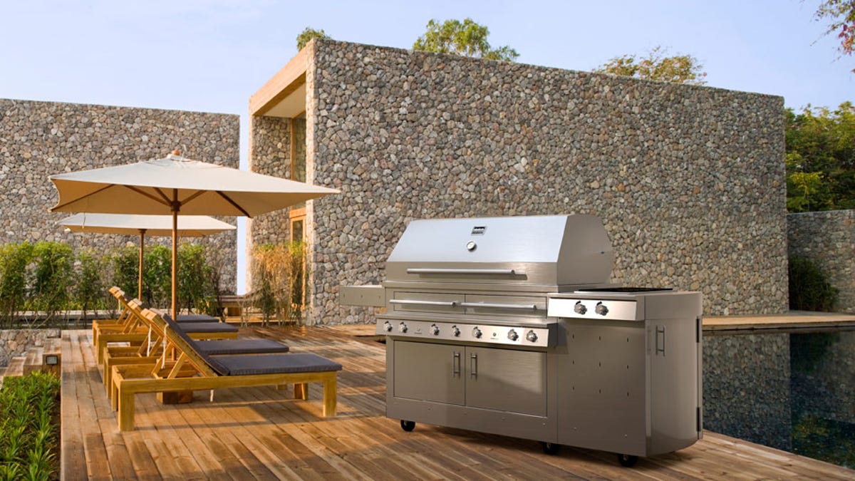 Gas, charcoal, or wood are all at home with this grill.