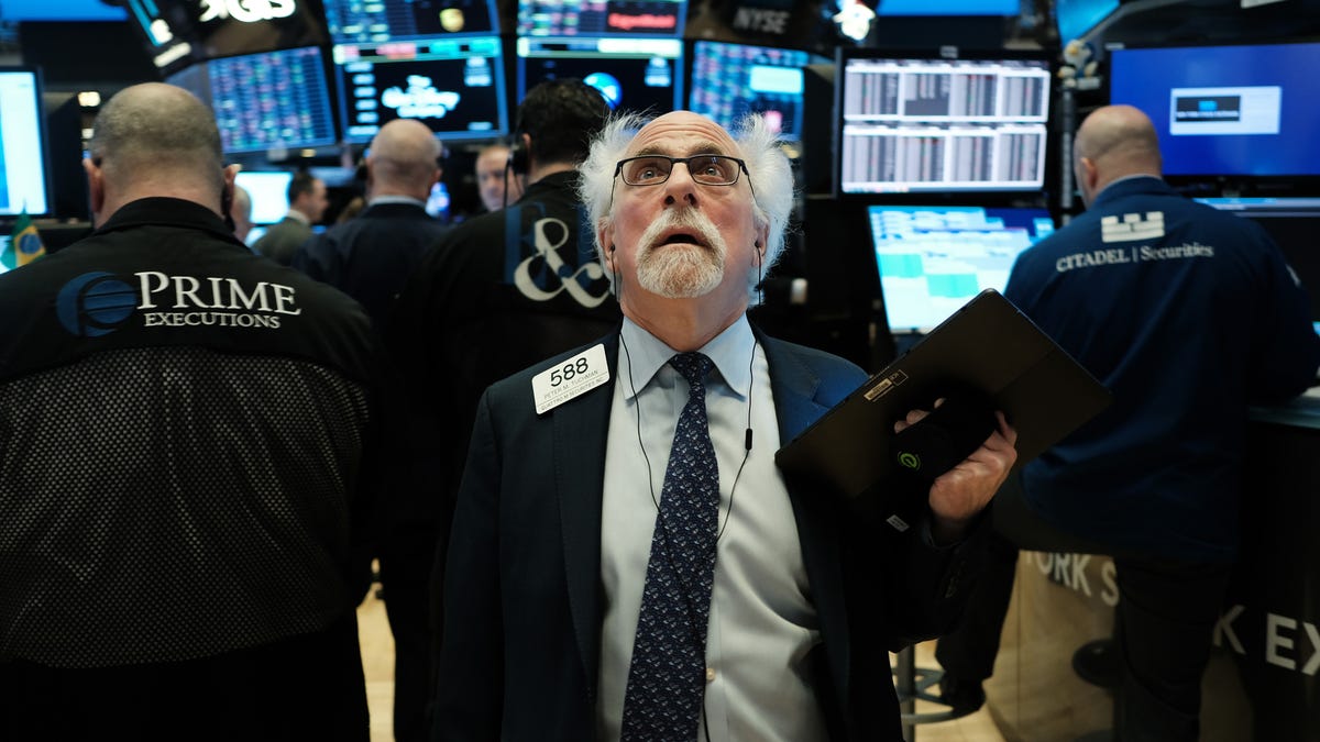 stock traders stares at monitor