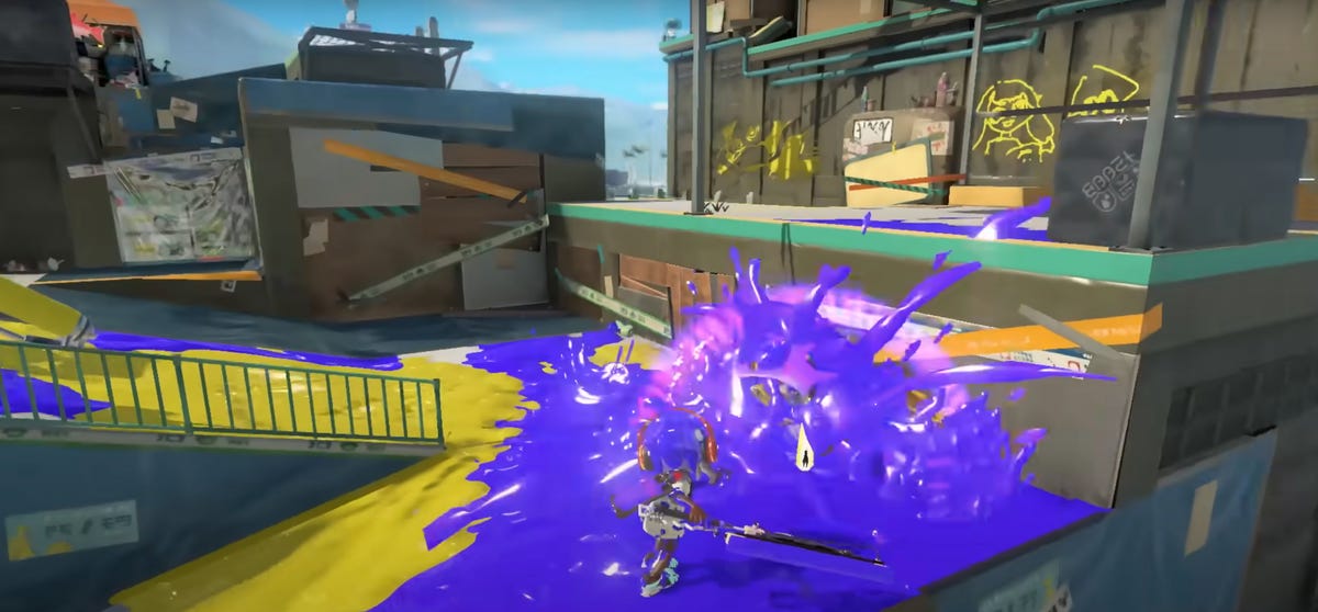 An purple Inkling attacks a yellow one with the Splatana Wiper in Splatoon 3