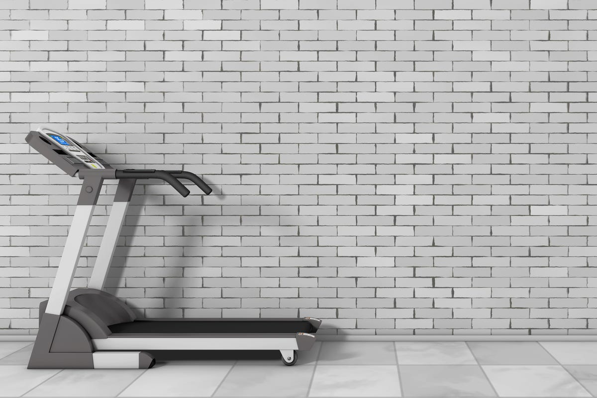 treadmill against gray wall