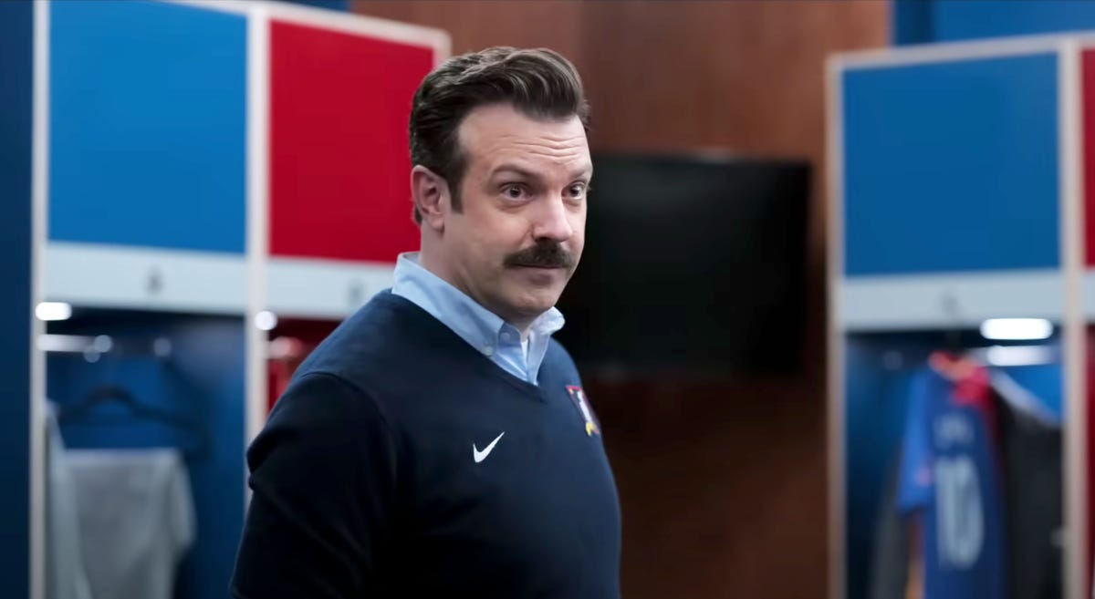 Ted lasso standing in the locker room