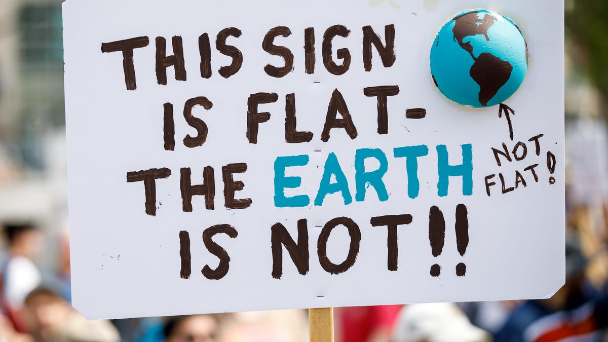 "This sign is flat -- the Earth is not!" said one sign at the Silicon Valley March for Science, urging people not to regress to an obsolete worldview science helped overturn.