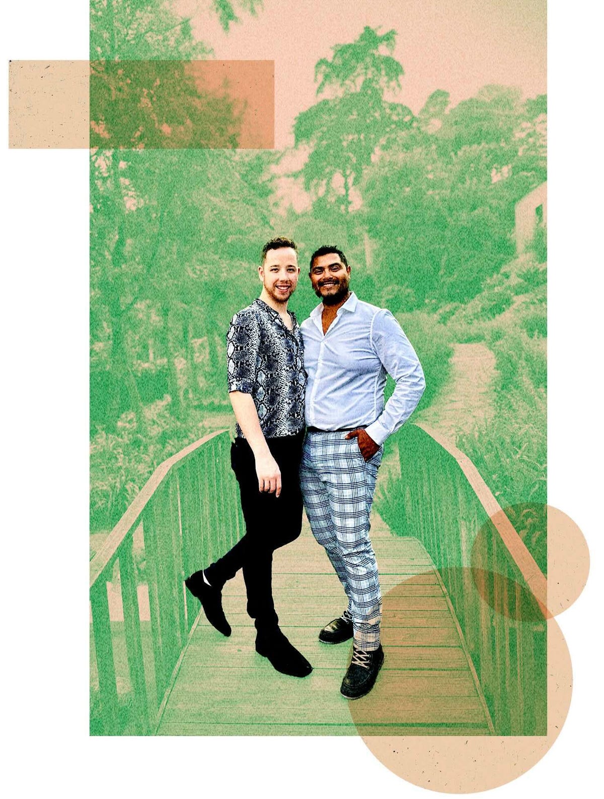 Two men stand side by side on a small bridge in a park