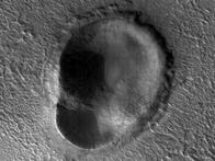 <p>This Martian impact crater has an odd shape that resembles an ear.</p>