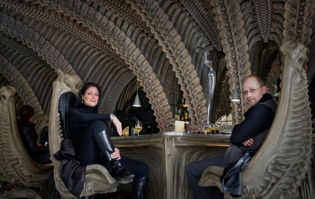 Watch out for face-huggers! Andy Davies and his wife Amy sit inside the Giger Bar in Gruyeres, Switzerland.