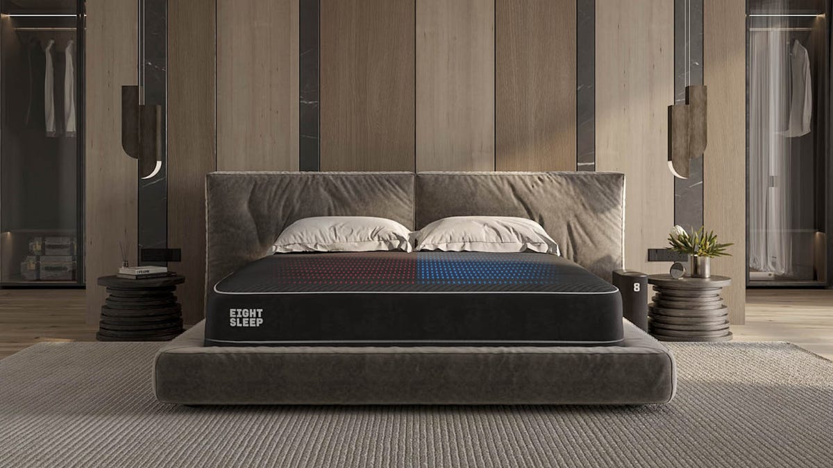 An Eight Sleep Pod 3 mattress in a grey/beige bedroom.