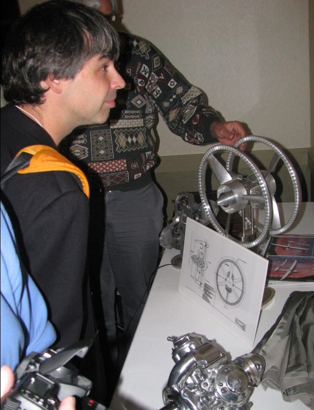 Larry Page checks out lightweight motors designed by Greg Stevenson.