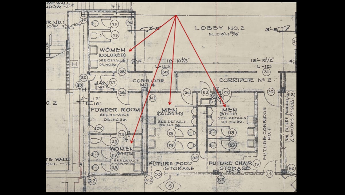 Blueprint of a theater showing segregated bathrooms