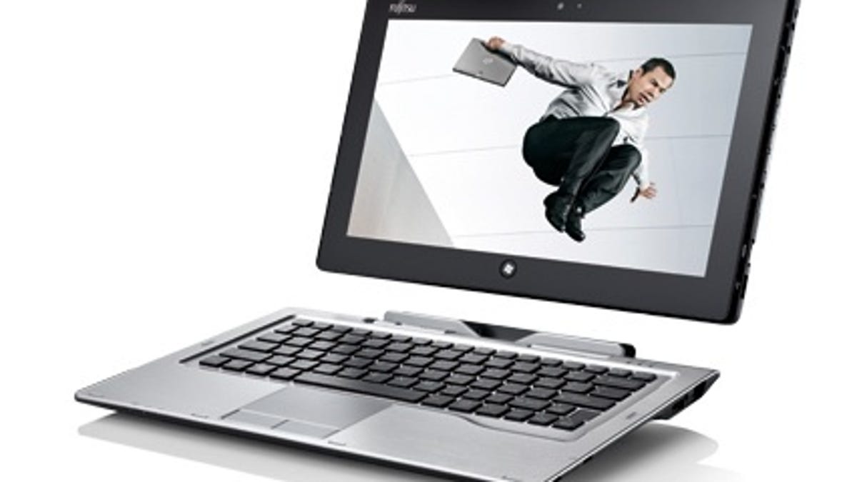 Fujitsu's Stylistic Q702 Windows 8 hybrid tablet-laptop. Fujitsu's president says Windows 8 PC sales are lacking.