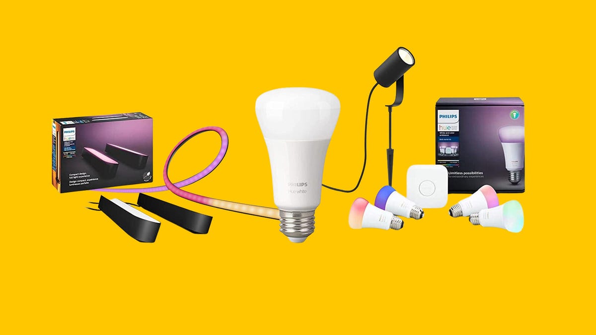 A number of smart lighting products from Philips Hue are displayed against a yellow background.