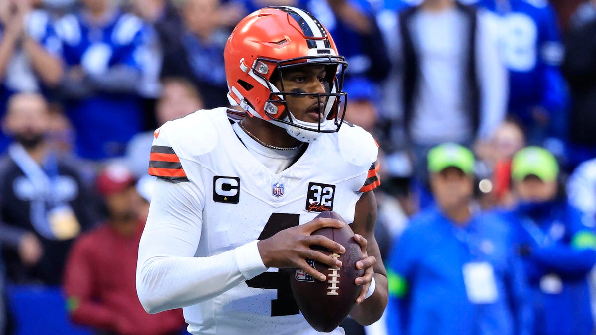 Cleveland Browns quarterback holding the ball with both hands.