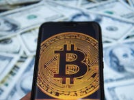 <p>KRAKOW, POLAND - 2018/11/13: Bitcoin logo is seen on an android mobile phone. (Photo by Omar Marques/SOPA Images/LightRocket via Getty Images)</p>