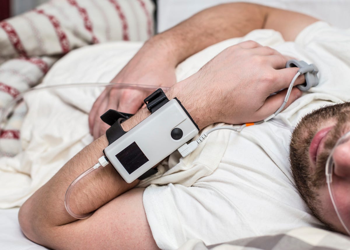 Man wearing a sleep apnea diagnostic medical device while sleeping. 